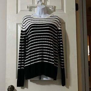 Knitted black and white striped sweater